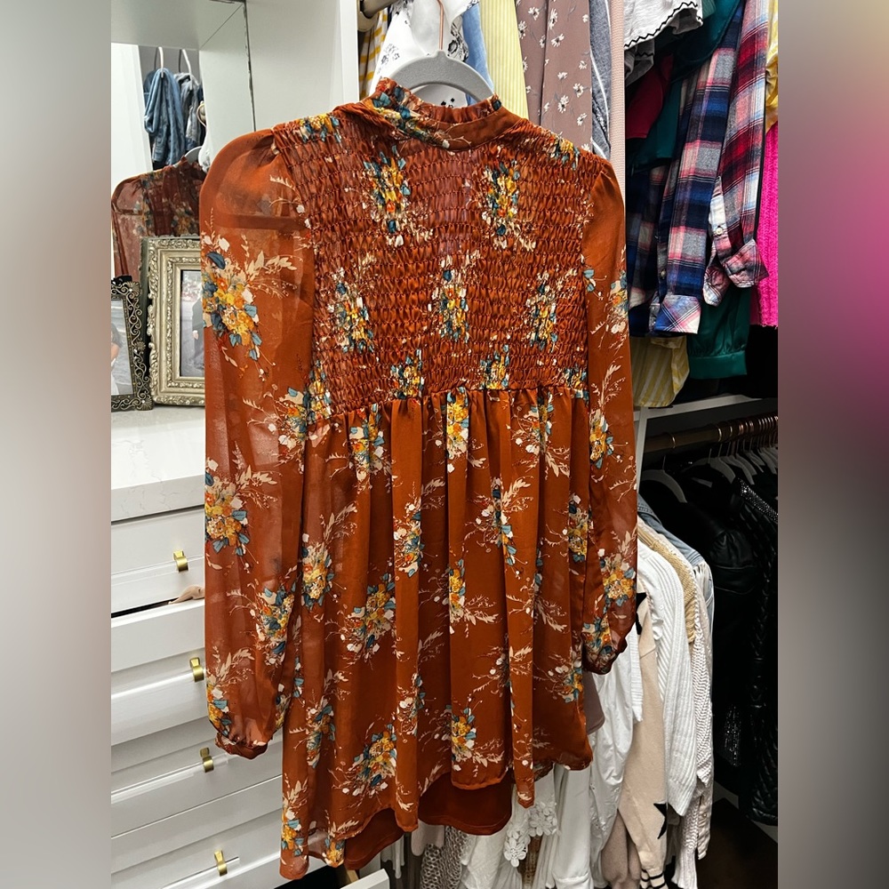 100% polyester, has under slip. Super cute for fall with boots